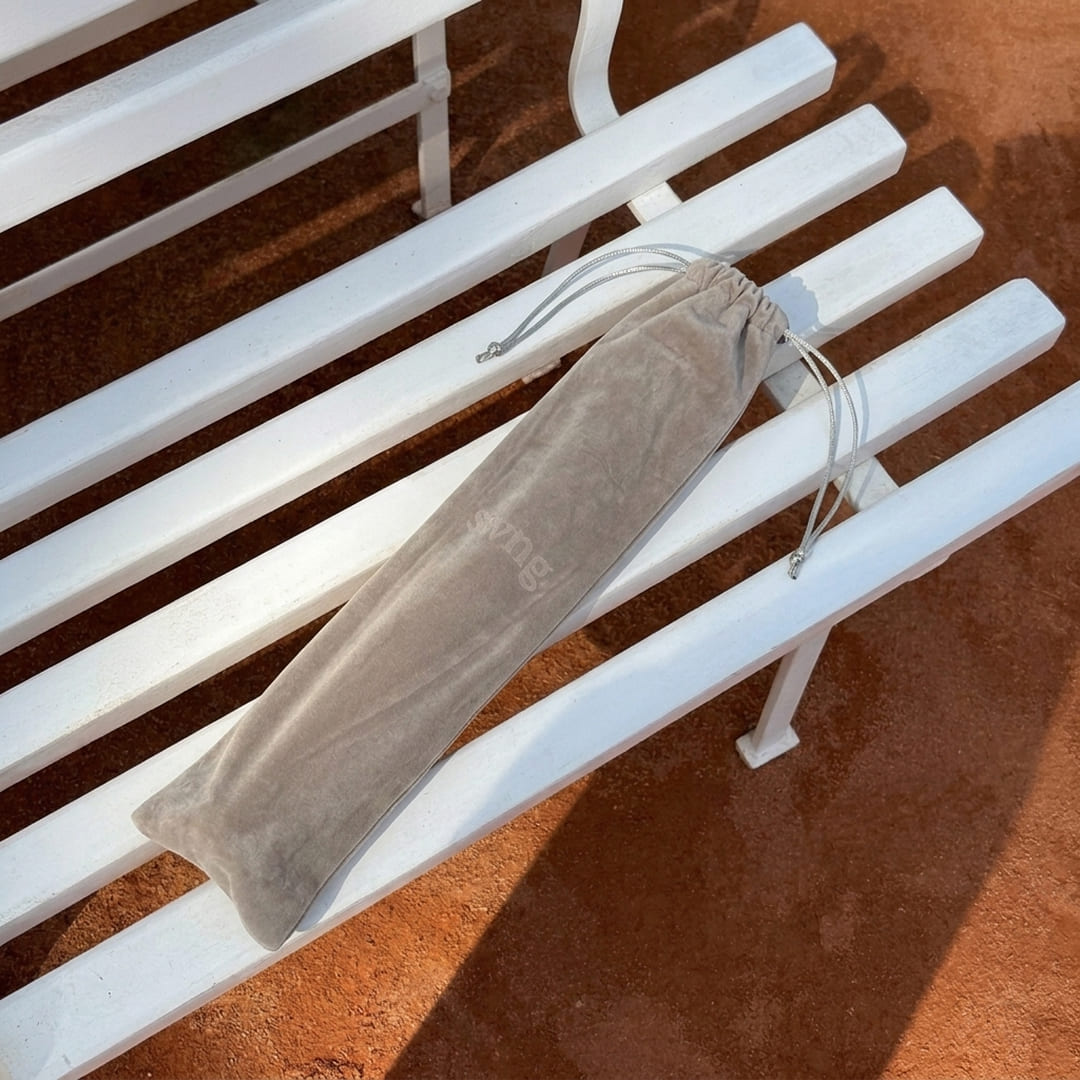 Swng Travel Sleeve on a bench