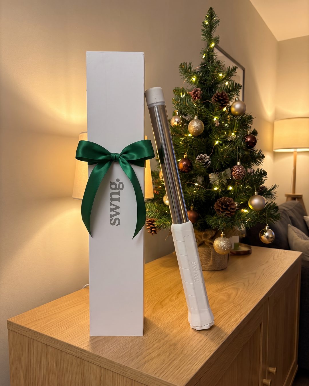 The SwngPro box with a green ribbon