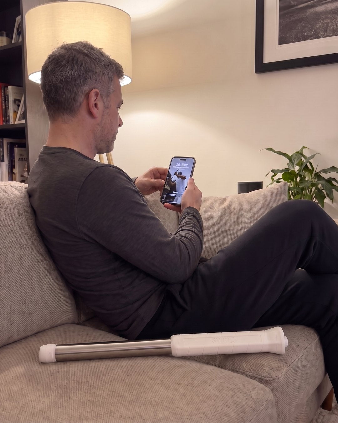 Opening the 15-Day Swing Transformation plan on his phone